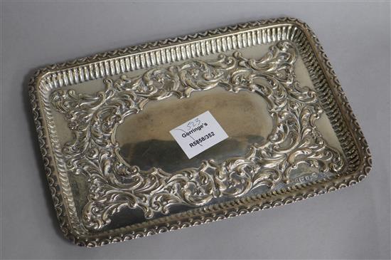 A late Victorian repousse silver dressing table tray by William Hutton & Sons, Birmingham, 1900, 8 oz.